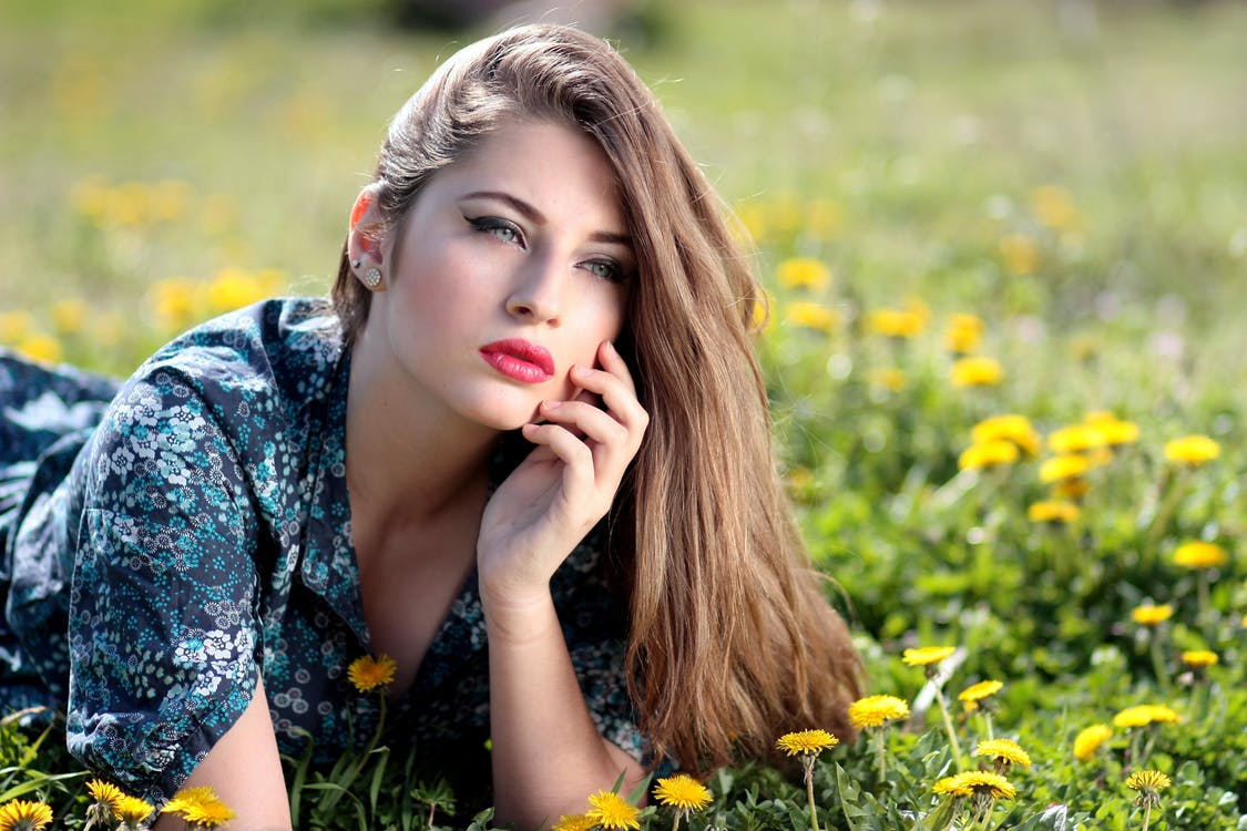 Model laying on grass